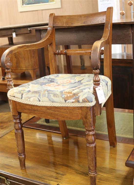 A Regency elm scroll armchair